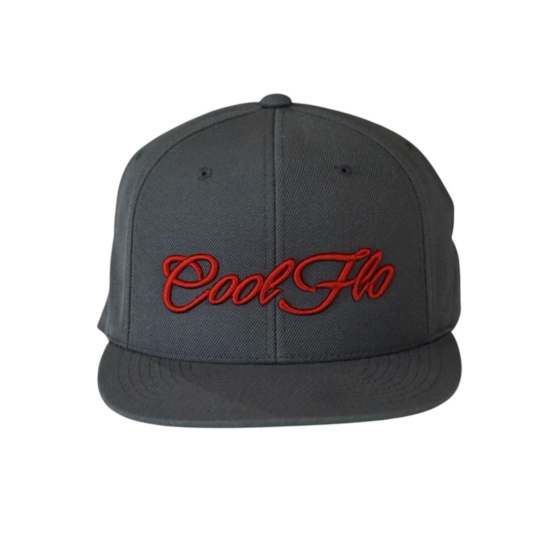 Dark grey snapback cap with red 3D embroidered Cool Flo script logo on the front.