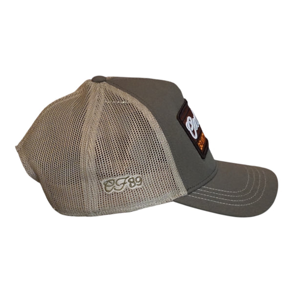 Side image of a Cool Flo Olive and Khaki Trucker featuring a Go With The Flo badge in brown, white and orange and CF89 side emboridery in olive on khaki. 