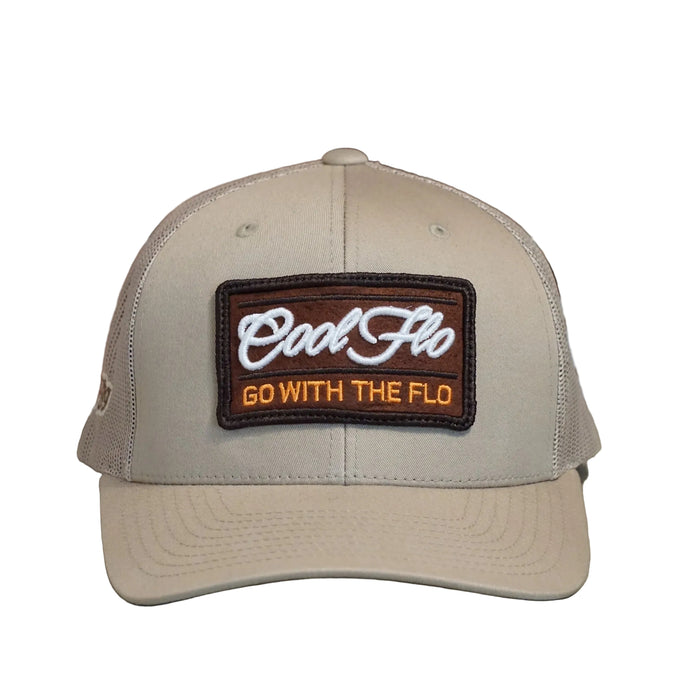 Front view of a Cool Flo Go With The Flo trucker cap in Khaki featuring an embroidered Go With The Flo badge and curved visor