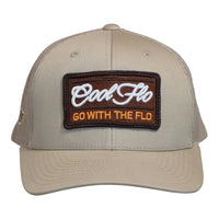 Front view of a Cool Flo Go With The Flo trucker cap in Khaki featuring an embroidered Go With The Flo badge and curved visor