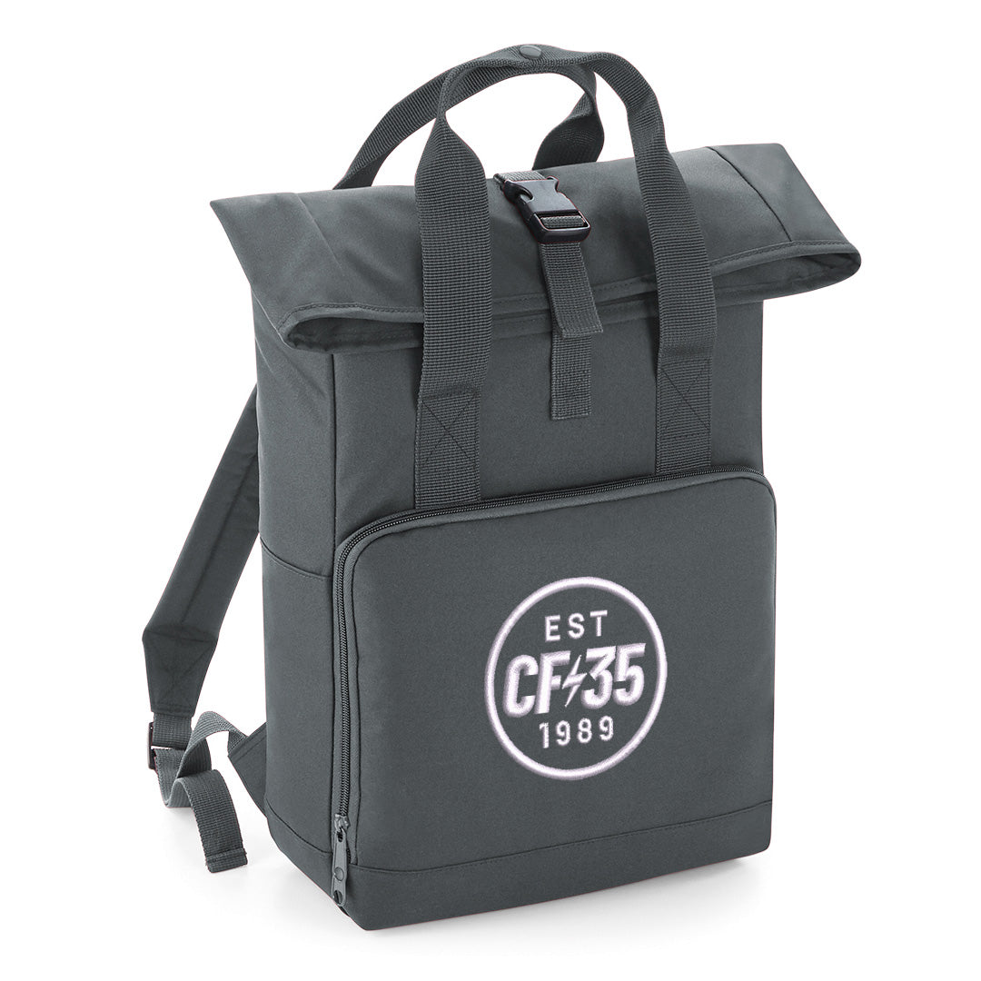 Grey rolltop backpack with embroidered white CF35 anniversary logo on front pocket