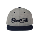 Two tone heather and navy snapback cap with embroidered 3D script logo in navy on the front. 