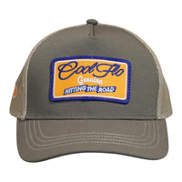 Front view of a Cool Flo Hitting The Road trucker cap in Olive/Khaki featuring an embroidered Hitting The Road badge in Orange, Blue and White and a curved visor