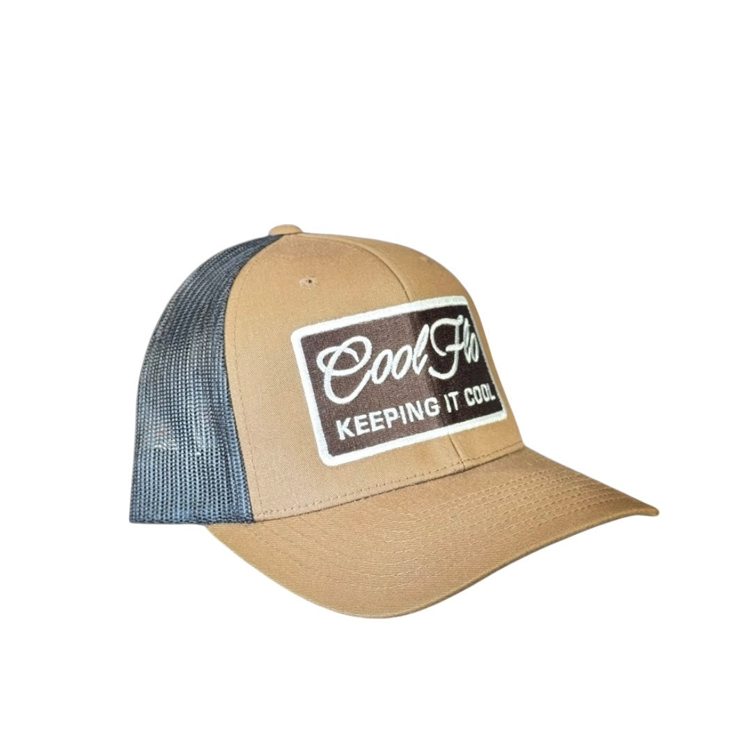 Side/front view of brown and black Keeping it Cool Two-tone Trucker Cap. Cool Flo logo and 'Keeping it Cool' rectangular badge design embroidered on the front in brown and white.