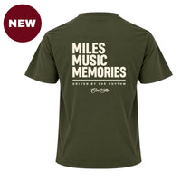 'NEW'  Back view of Cool Flo khaki t-shirt, featuring a cream graphic print that reads 'MILES MUSIC MEMORIES.' with the strapline 'DRIVEN BY THE RHYTHM' and a central 'Cool Flo' logo below.