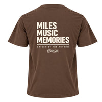  Back view of Cool Flo mocha t-shirt, featuring a cream graphic print that reads 'MILES MUSIC MEMORIES.' with the strapline 'DRIVEN BY THE RHYTHM' and a central 'Cool Flo' logo below.