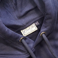 Close-up of neck detail on Navy blue hoody with large Cool Flo script logo in matching high-build 3D embroidery .