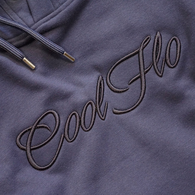 Close-up of high-build 3D embroidery on Navy blue hoody with large Cool Flo script logo.