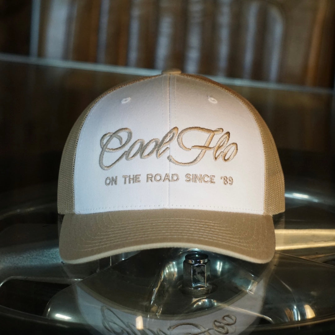 Cool Flo khaki and white trucker cap with khaki embroidered logo and 'On the road since '89' design.