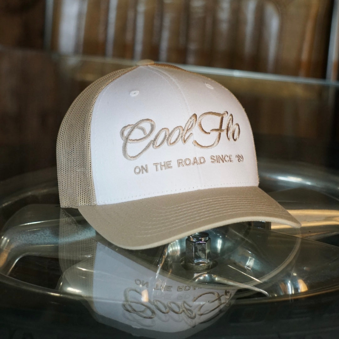 Cool Flo khaki and white trucker cap with khaki embroidered logo and 'On the road since '89' design.