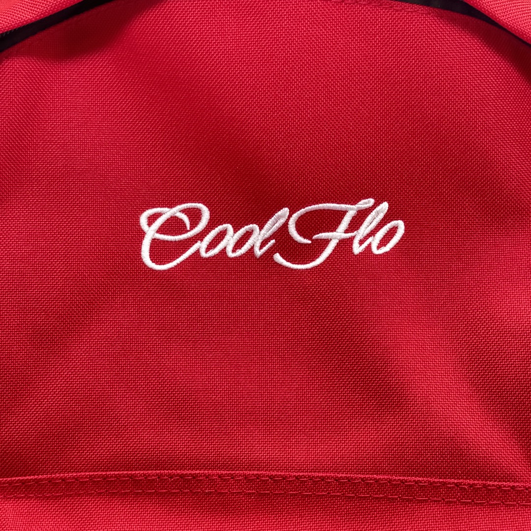 Close-up of Classic red backpack with embroidered white Cool Flo logo on the front