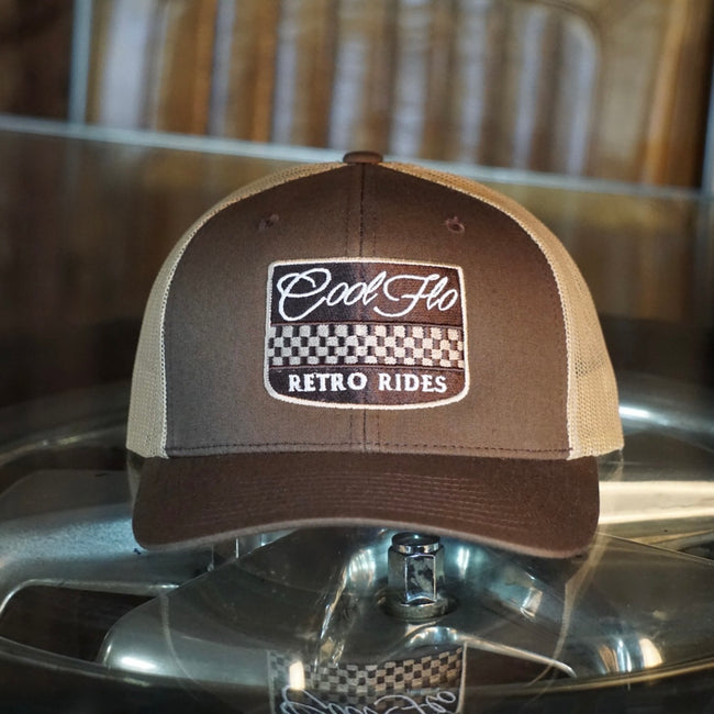 Cool Flo Retro Rides brown trucker cap with embroidered chequered badge design in white, cream and brown