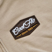 Close-up of badge detail on Sand zip hoody with Cool Flo 3D puff embroidered badge in brown, white and orange.