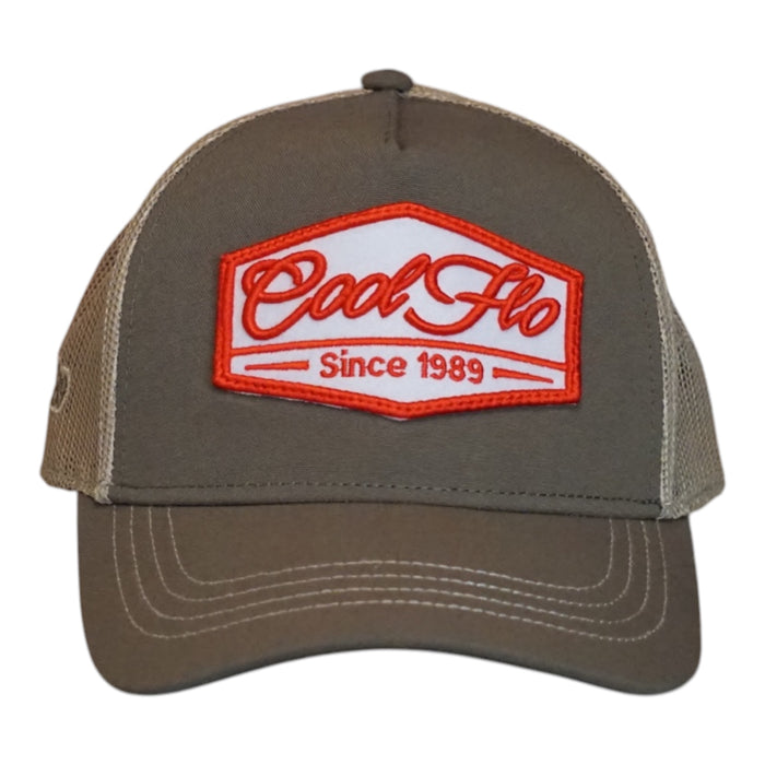 A trucker cap with an olive front and khaki mesh back, featuring a prominent embroidered front patch that reads 'Cool Flo Since 1989' in red and white.