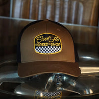 Cool Flo Black & brown trucker cap with  logo and Speed Shop chequered design in yellow, black and white embroidery.