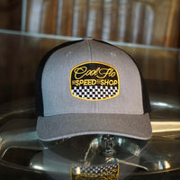 Cool Flo grey and black trucker cap with  logo and Speed Shop chequered design in yellow, black and white embroidery.