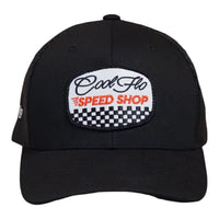 Front view of a Cool Flo Speed Shop trucker cap in Black featuring an embroidered Speed Shop badge and a curved visor
