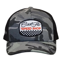 Front view of a Cool Flo Speed Shop trucker cap in Dark Camo featuring an embroidered Speed Shop badge, camo print panels and a curved visor