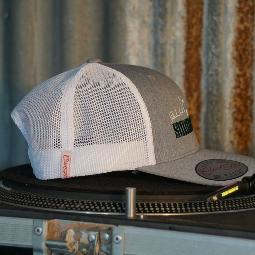 Centreforce Summer in the City event trucker cap (heather grey & white) placed on a record turntable 