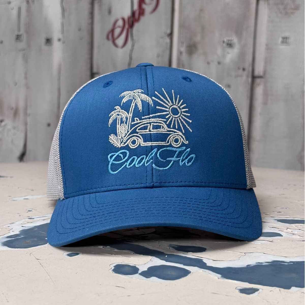 Cool Flo Surf Bug trucker cap in Blue/Silver featuring embroidered Surf Bug artwork and breathable mesh back panels.