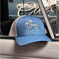 Cool Flo Surf Bus trucker cap in Blue/silver featuring embroidered Surf Bus artwork and breathable mesh back panels, displayed on a Cool Flo Classic vehicle.