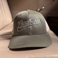 Front view of a Cool Flo Moss/Khaki trucker cap featuring a raised 3D embroidered Swoosh logo in Moss/Khaki and a curved visor