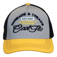 Front view of a Cool Flo Threads & Treads trucker cap in Yellow/Black/White featuring embroidered Threads & Treads artwork with a structured front panel and curved visor
