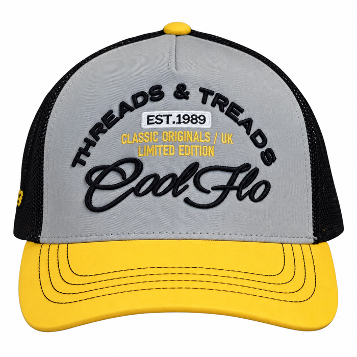 Front view of a Cool Flo Threads & Treads trucker cap in Yellow/Black/White featuring embroidered Threads & Treads artwork with a structured front panel and curved visor.