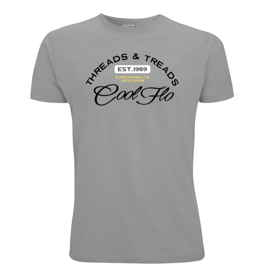 A misty grey short-sleeve t-shirt with a Cool Flo Threads & Treads print in black, yellow and white.