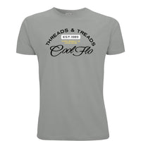 A misty grey short-sleeve t-shirt with a Cool Flo Threads & Treads print in black, yellow and white.