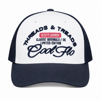 Front view of a navy and white Cool Flo Threads & Treads trucker cap with raised embroidered logo and navy curved visor.