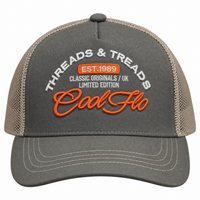 Front view of a Cool Flo Threads & Treads trucker cap in Olive/Khaki featuring embroidered Threads & Treads artwork with a structured front panel and curved visor.