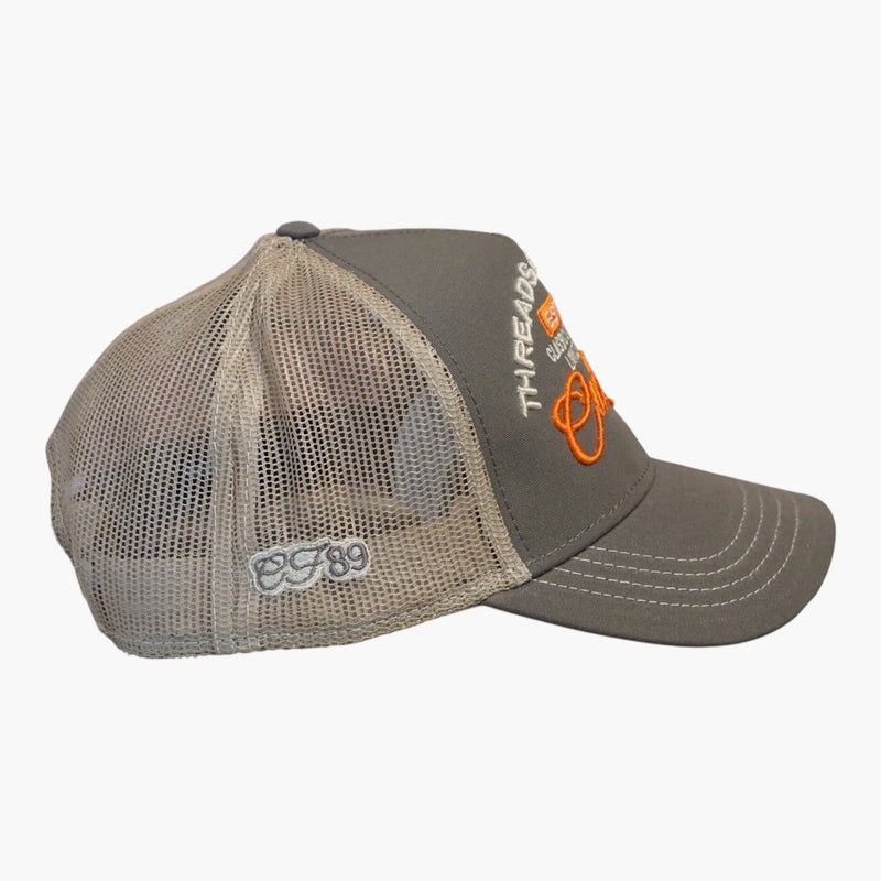 Right side view of a Cool Flo Olive/Khaki Threads & Treads trucker cap featuring breathable mesh back panels, CF89 embroidered side detail and adjustable snapback fastening