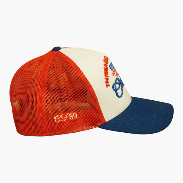 Right side view of a Cool Flo White/Red/Blue Threads & Treads trucker cap featuring breathable mesh back panels, CF89 embroidered side detail and adjustable snapback fastening