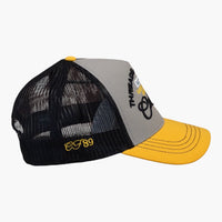 Right side view of a Cool Flo Yellow/Grey/Black Threads & Treads trucker cap featuring breathable mesh back panels, CF89 embroidered side detail and adjustable snapback fastening