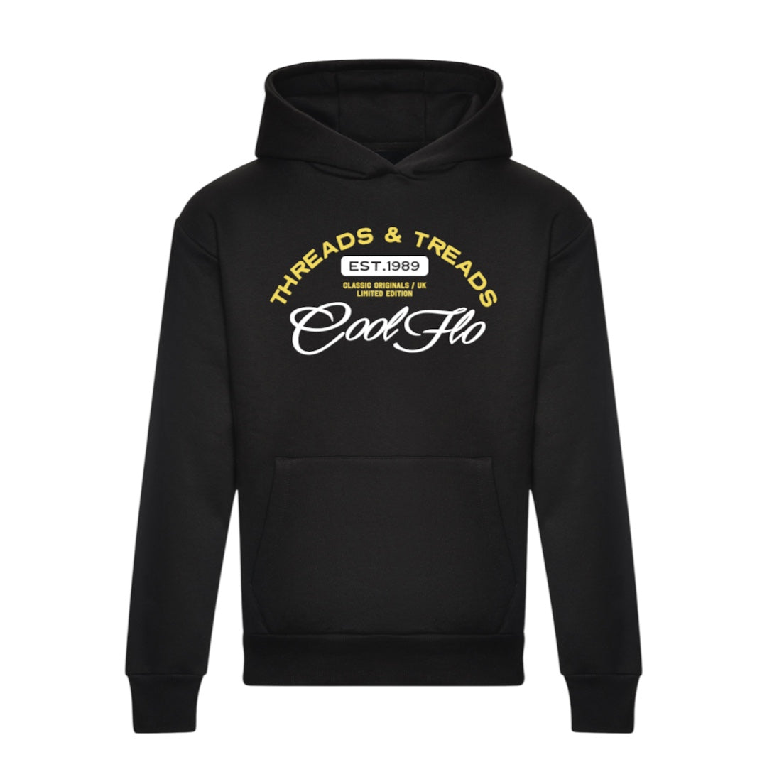 A black hoody with a Cool Flo Threads & Treads print in white and yellow.