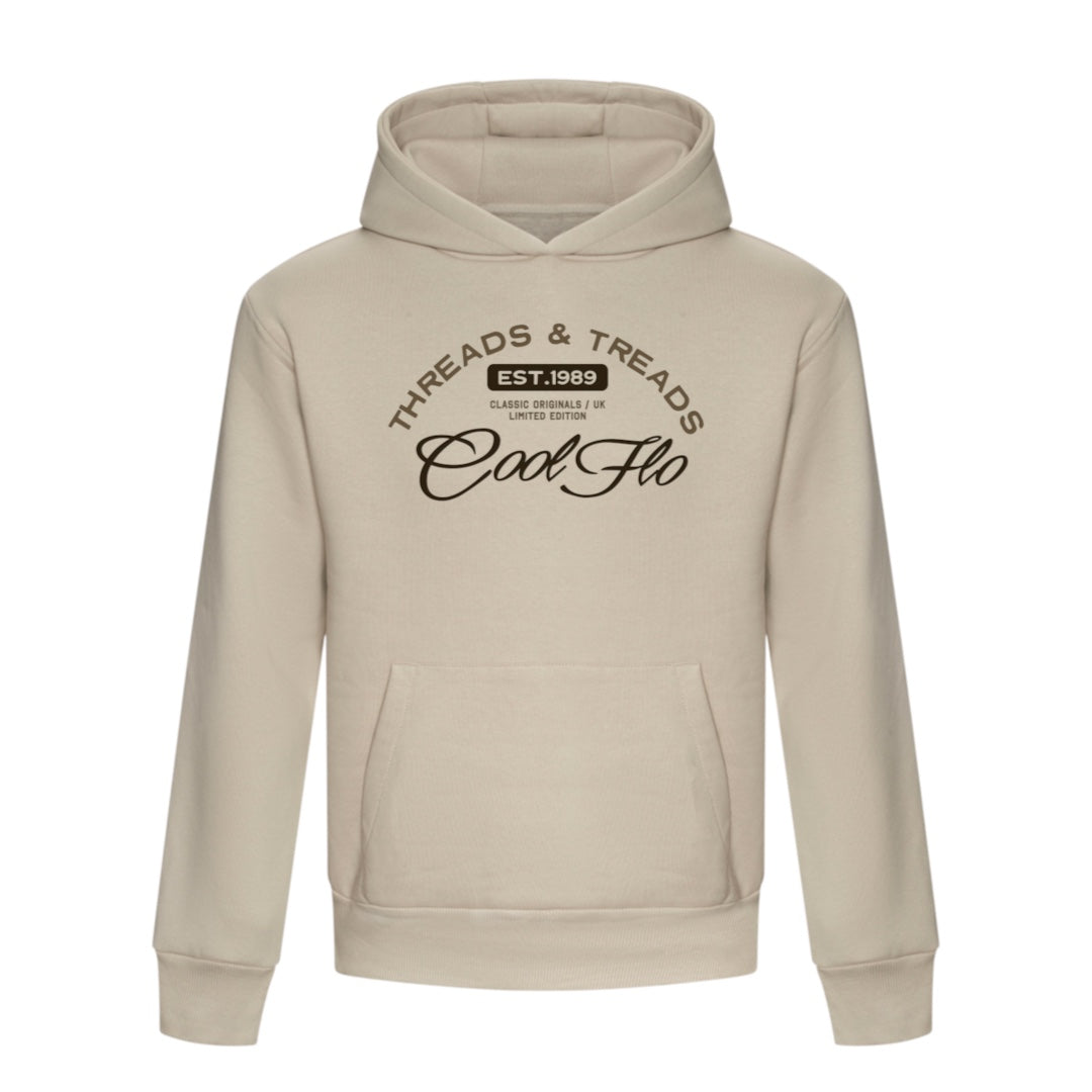 A stone-coloured hoody with a Cool Flo Threads and Treads print in light and brown print.