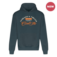 A teal hoody with a Cool Flo Threads and Treads print in cream and orange.