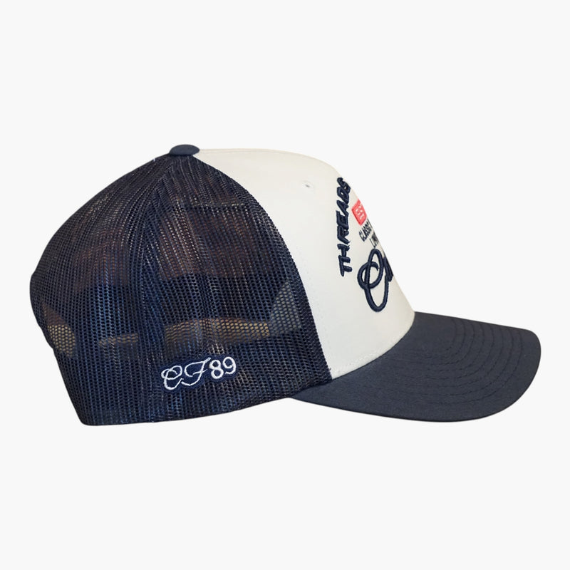 Right side view of a Cool Flo White/Navy Threads & Treads trucker cap featuring breathable mesh back panels, CF89 embroidered side detail and adjustable snapback fastening