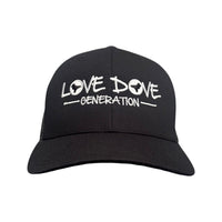 Black trucker cap with embroidered white 'Love Dove Generation' on the front_close up of embroidered logo - front view.