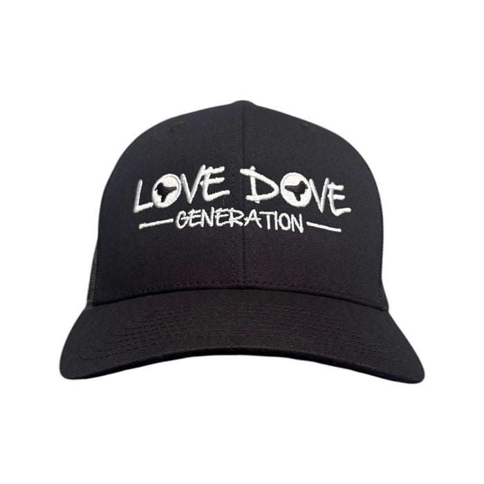 Black trucker cap with embroidered white 'Love Dove Generation' on the front_close up of embroidered logo - front view.