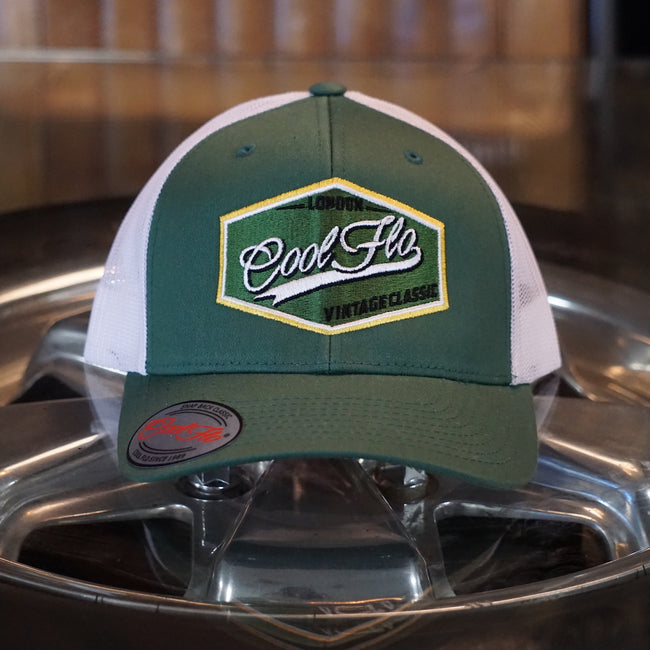 Cool Flo Vintage Classic Trucker Cap in fir green and white with an embroidered badge design with a retro feel. London - Cool Flo - Vintage Classic.