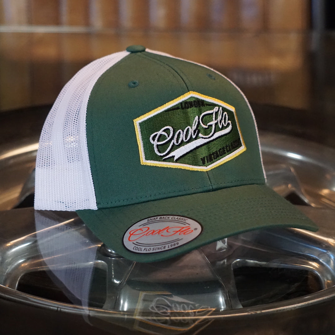 Cool Flo Vintage Classic Trucker Cap in fir green and white with an embroidered badge design with a retro feel. London - Cool Flo - Vintage Classic.