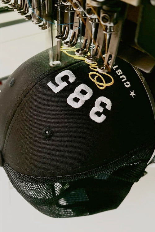 Cool Flo Custom Edition Cap in production on embroidery machine